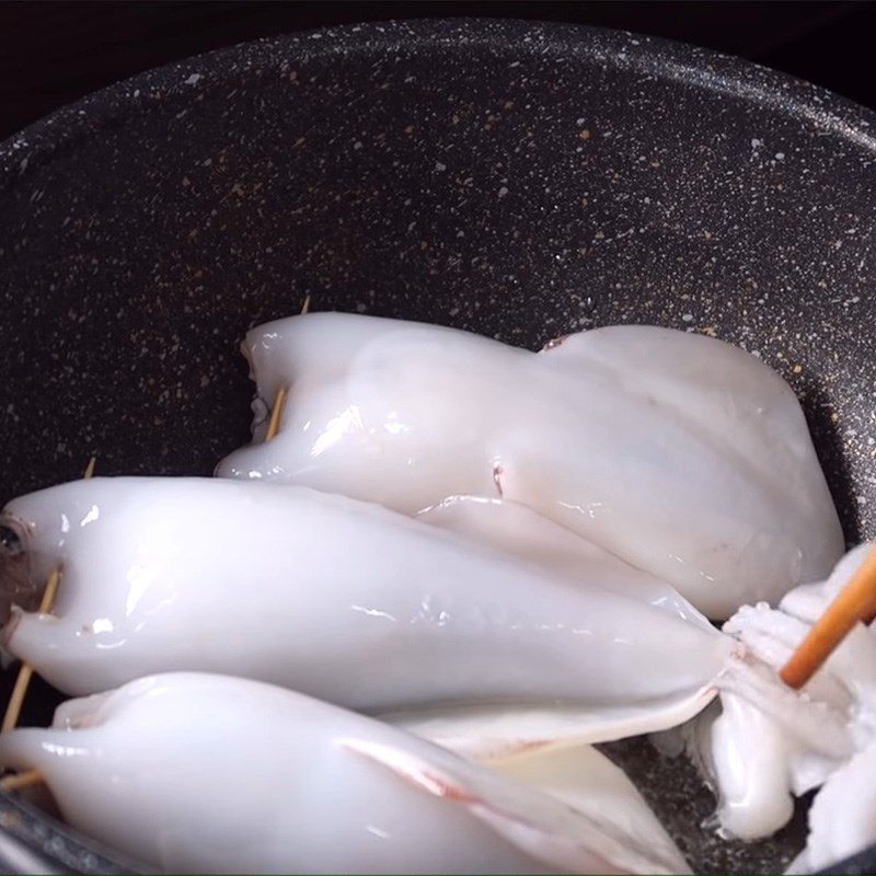 Step 4 Cooking squid Squid stuffed with meat simmered in coconut water