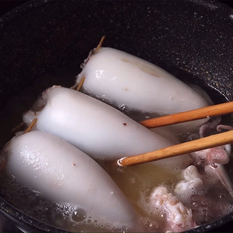 Step 4 Cooking squid Squid stuffed with meat simmered in coconut water