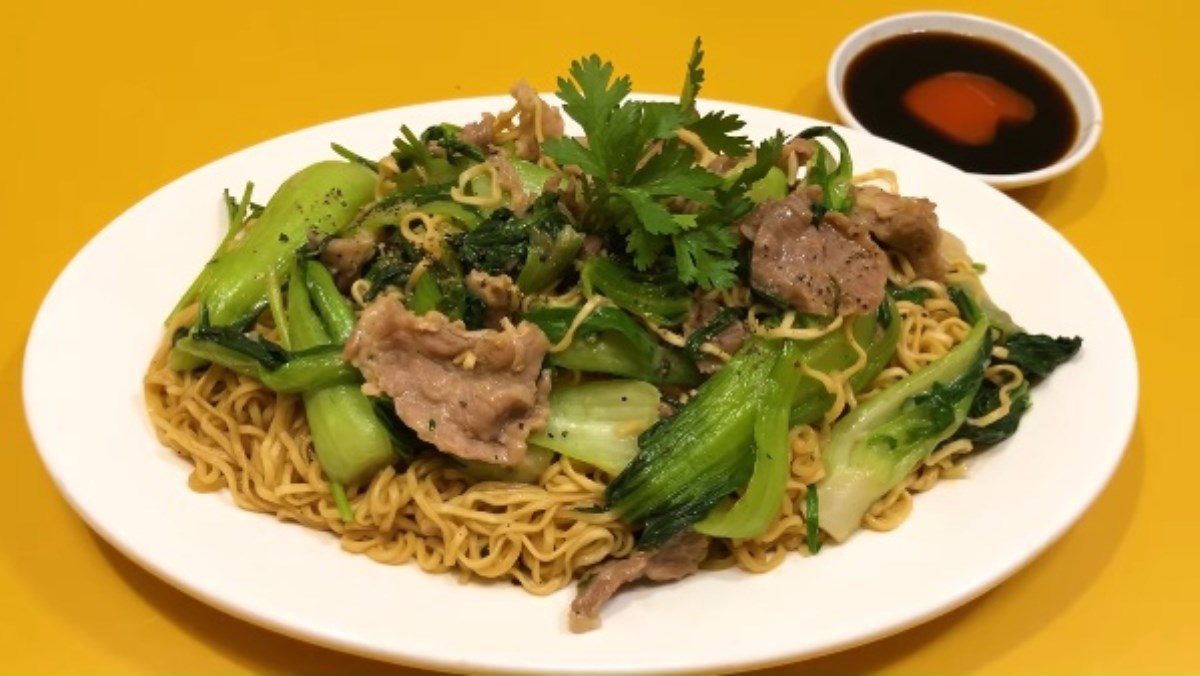 Stir-fried beef noodles with bok choy