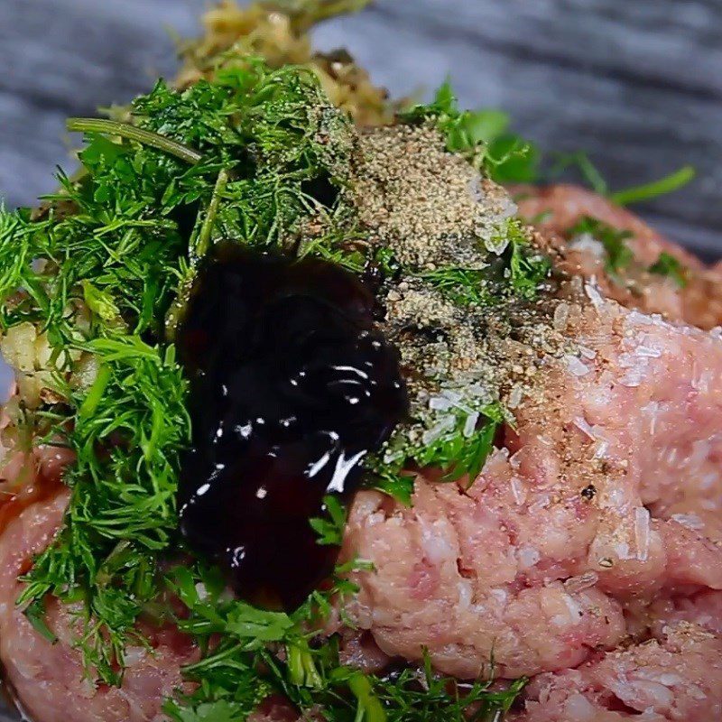 Step 2 Marinating the meat Pork meatballs wrapped with straw mushrooms