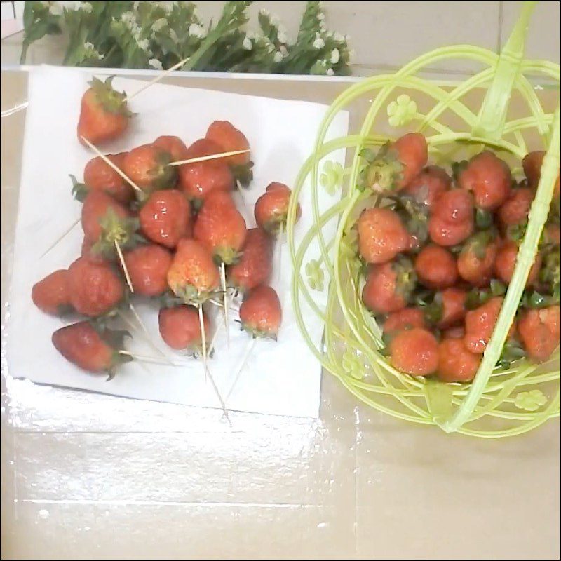 Step 1 Insert toothpicks into the strawberries for Strawberry Flower Basket