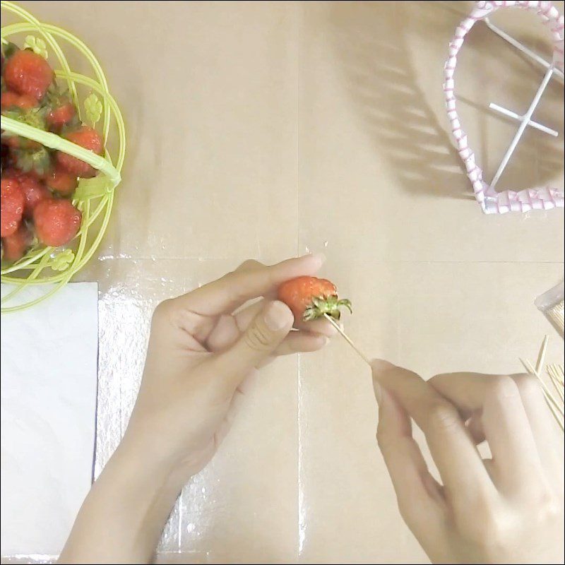 Step 1 Insert toothpicks into the strawberries for Strawberry Flower Basket