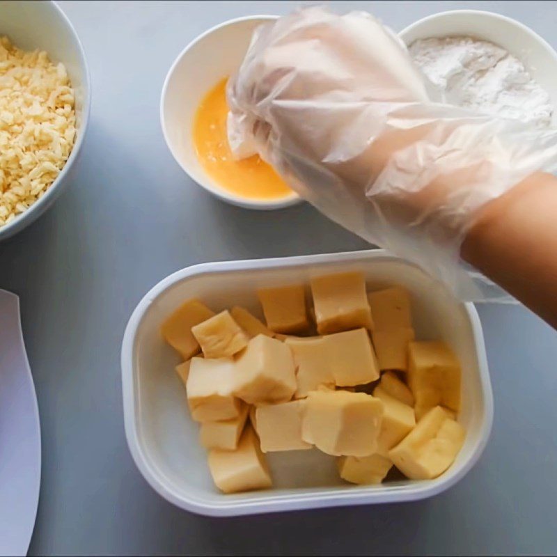 Step 3 Coating the cake with batter Fresh milk cake fried with flour