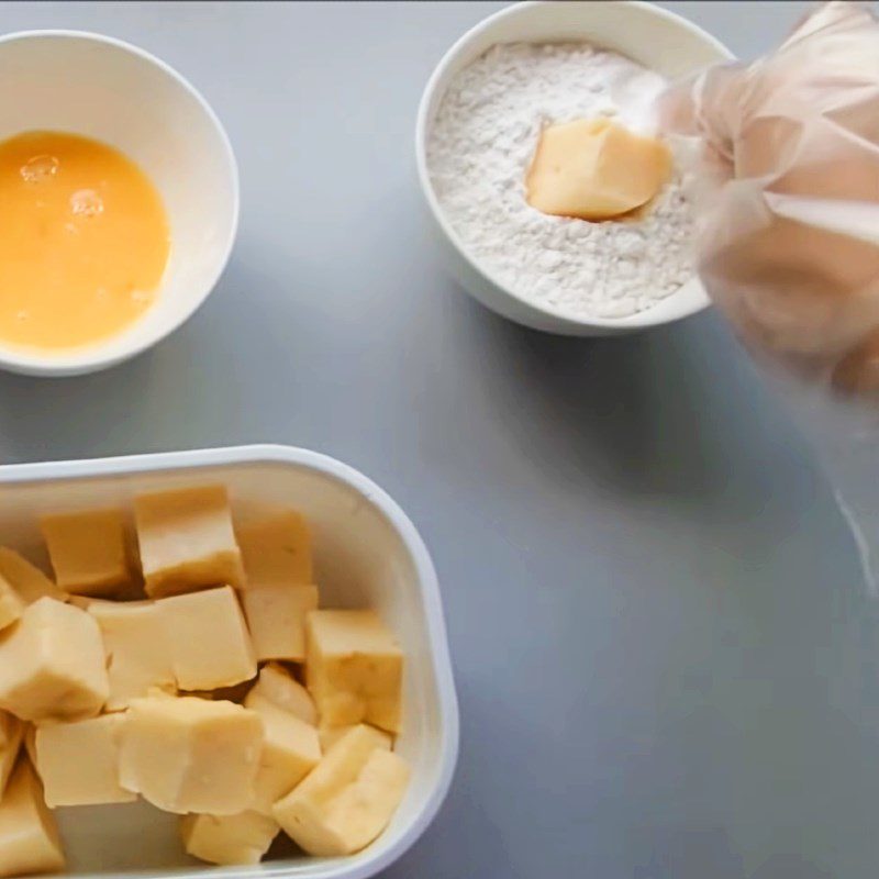 Step 3 Coating the cake with batter Fresh milk cake fried with flour