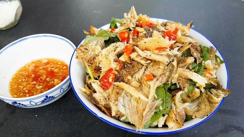 Cucumber salad with dried snakehead fish