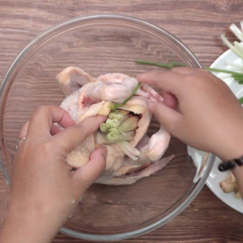 Step 3 Stuff the ingredients into the chicken's belly and secure Chicken soaked in fish sauce