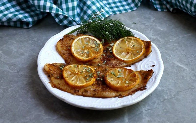 Grilled basa fish fillet with butter and lemon