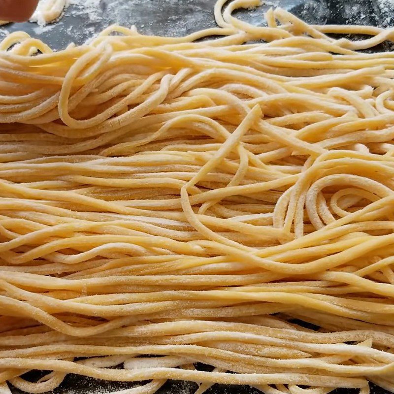 Step 2 Rolling dough and cutting into small strands Fresh egg noodles