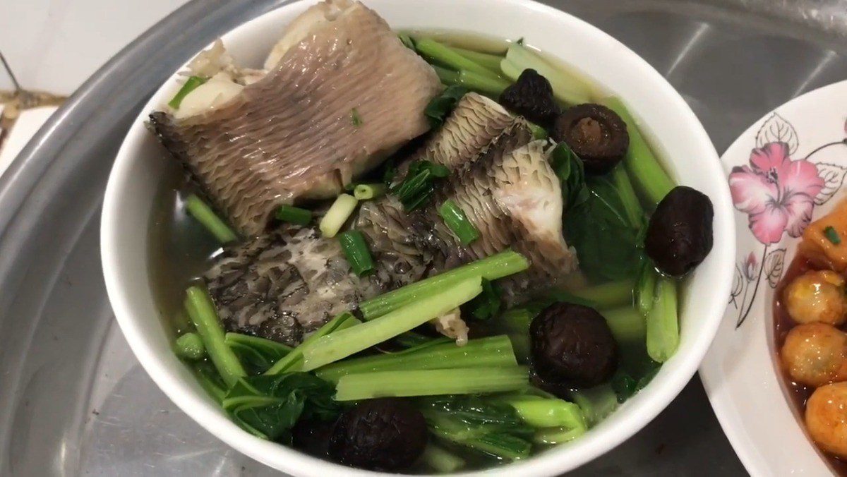 Mustard greens soup with snakehead fish