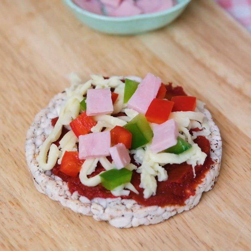 Step 2 Add the filling on the brown rice cake Mini brown rice pizza