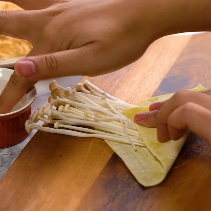 Step 2 Wrap the mushrooms Crispy enoki mushrooms wrapped in wontons