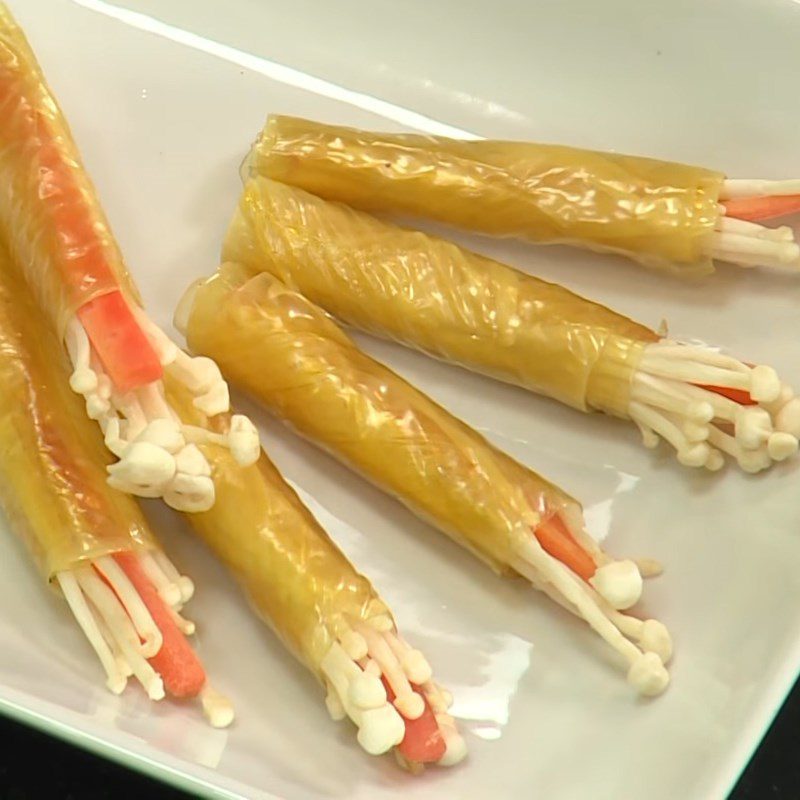 Step 2 Rolling tofu skin Tofu skin rolled with enoki mushrooms in oyster sauce