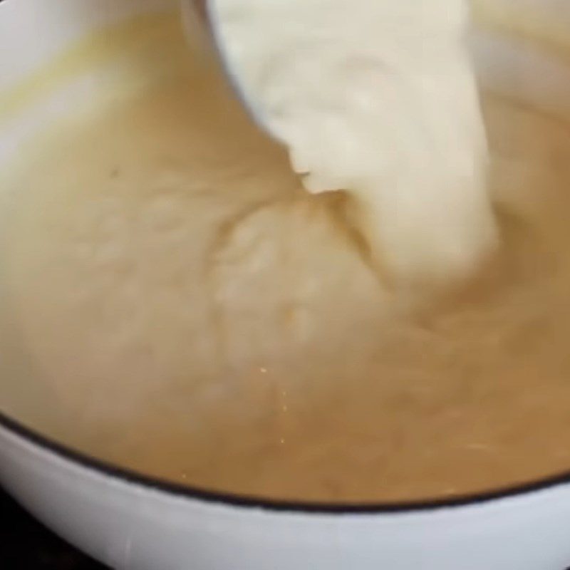 Step 4 Mixing the egg and milk mixture Rice pudding - Coconut milk mango rice pudding