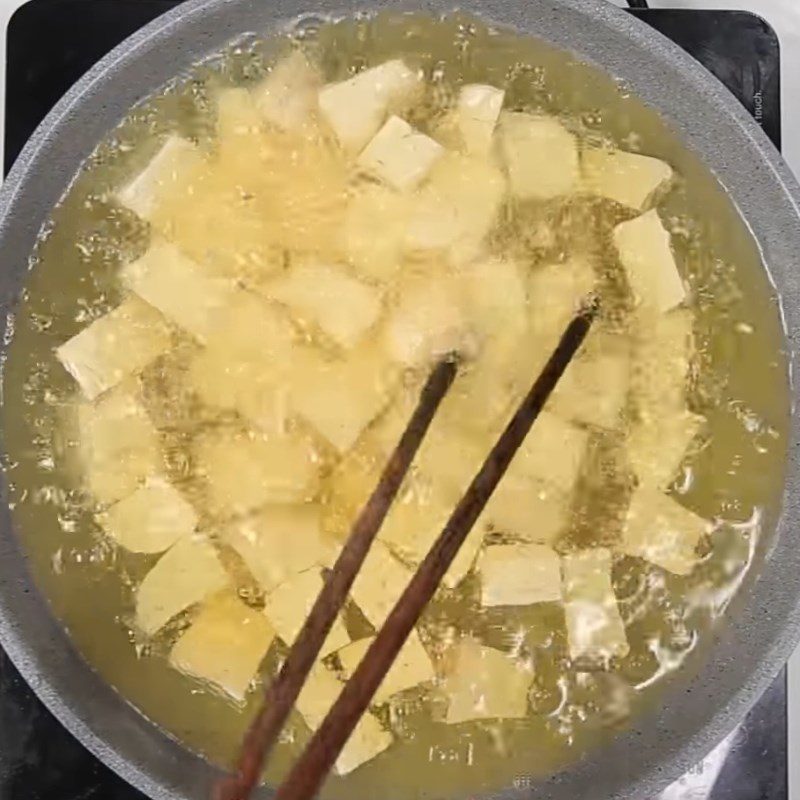 Step 2 Fry the tofu Fried tofu with soy sauce and bell peppers