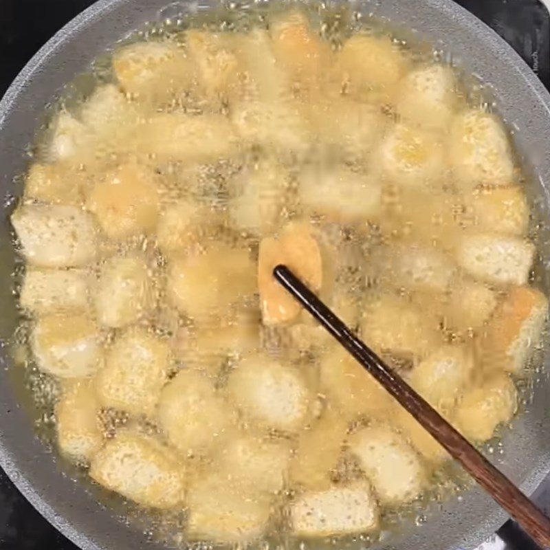 Step 2 Fry the tofu Fried tofu with soy sauce and bell peppers