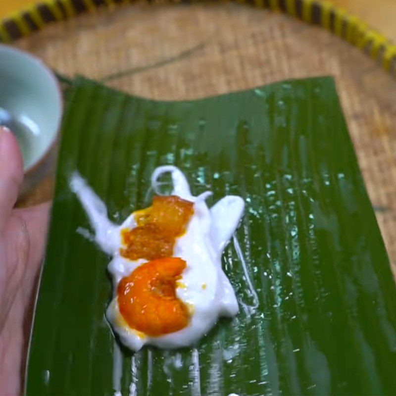 Step 4 Wrapping the cake Filter cake in banana leaf