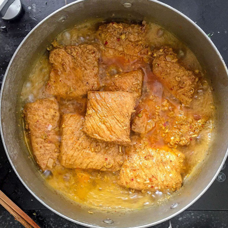 Step 2 Boil the meat until cooked for Spicy Sour Plum Dried Pork