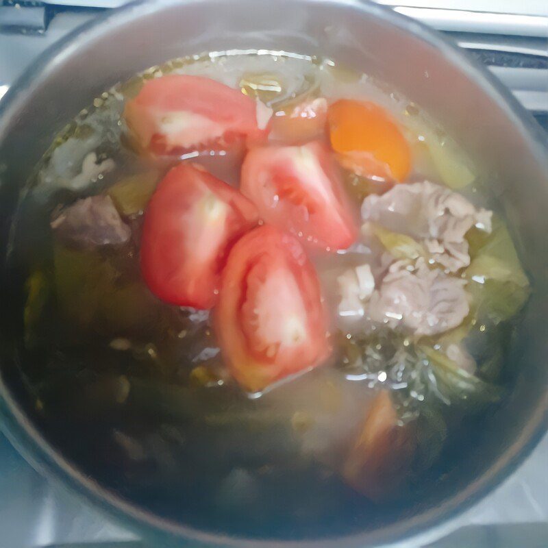 Step 3 Cooking sour melon soup with beef and tần vegetables