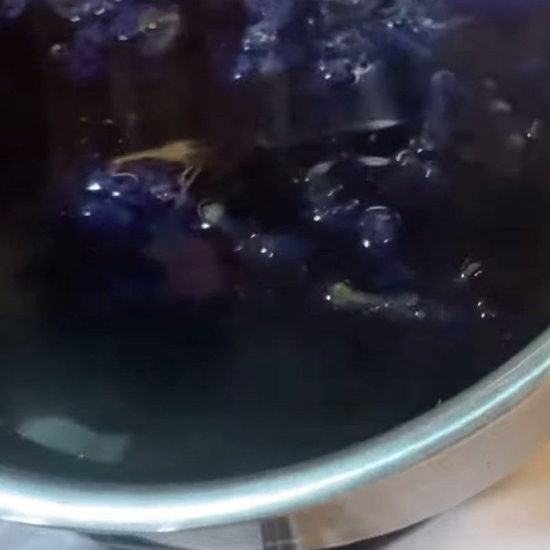 Step 2 Cooking butterfly pea flower water Sticky rice with butterfly pea flower and coconut milk using a rice cooker