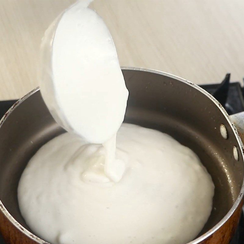 Step 6 Fry the cake Grilled cake with coconut filling in a pan