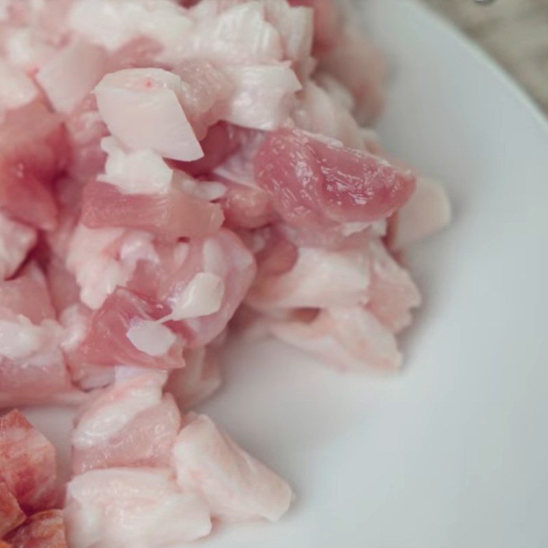 Step 1 Prepare and marinate the meat for Mooncake with layers of sticky rice and braised pork filling