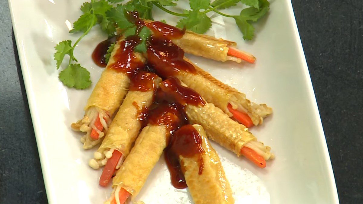 Fried tofu skin rolls with enoki mushrooms in oyster sauce