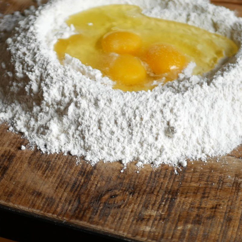 Step 1 Mixing the dough for cheese-filled ravioli with melted eggs