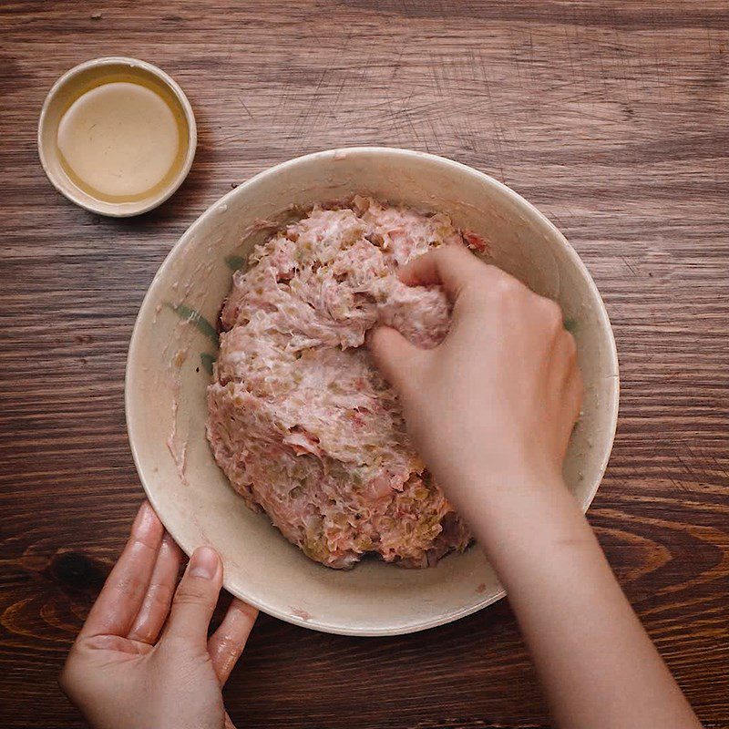 Step 1 Mix the meat with spices for Hanoi Com Cake