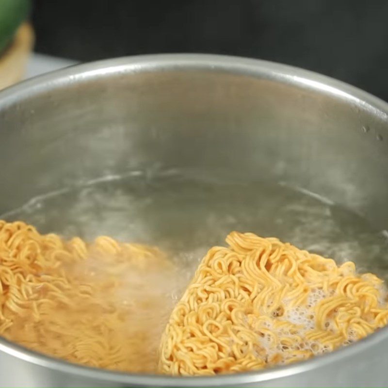 Step 1 Blanch the noodles Egg Rolled Instant Noodles with Canned Fish