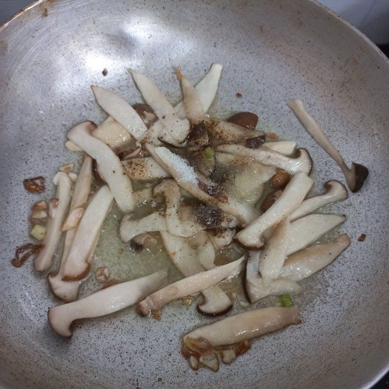 Step 2 Stir-fry the mixture for Stir-fried Napa cabbage with king oyster mushrooms