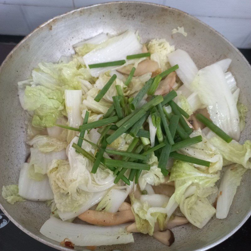 Step 2 Stir-fry the mixture for Stir-fried Napa cabbage with king oyster mushrooms