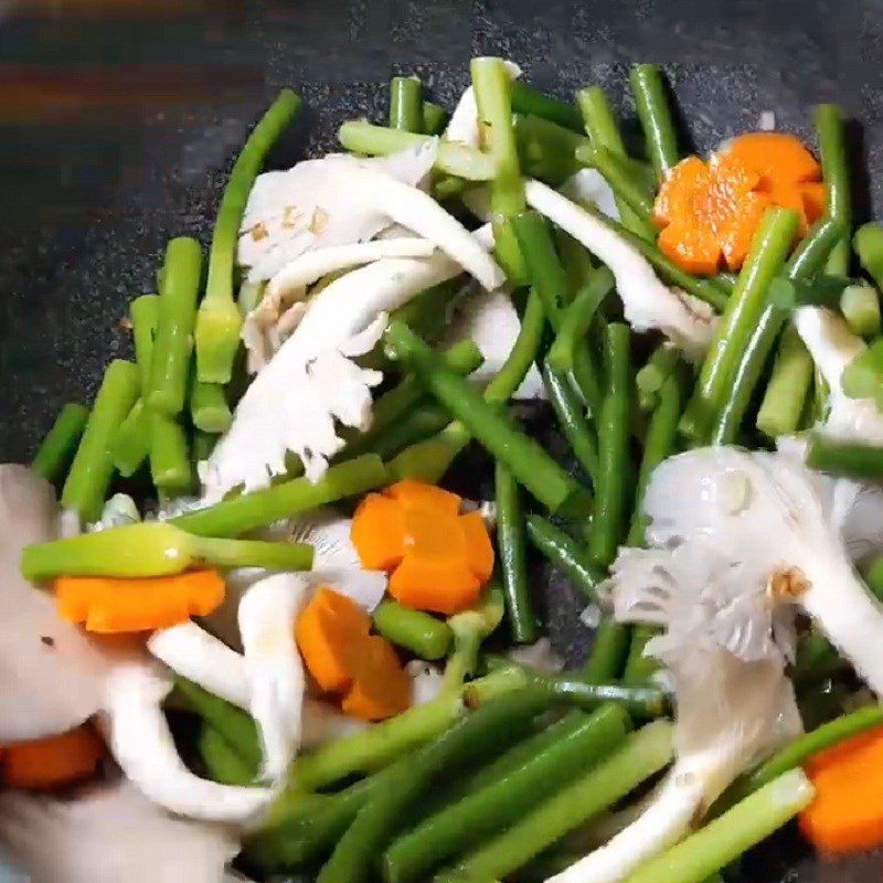 Step 4 Stir-fry garlic shoots Garlic shoots stir-fried with mushrooms