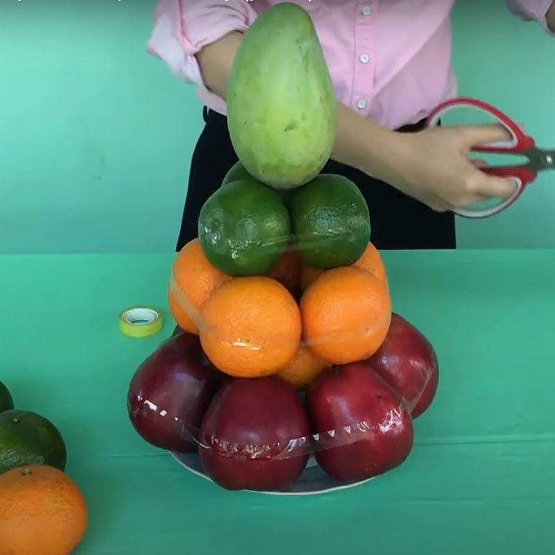 Step 1 Arrange fruits with adhesive tape How to arrange different types of fruits with tape