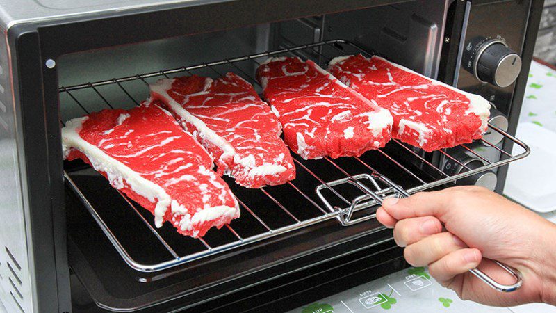 Defrosting food with an oven