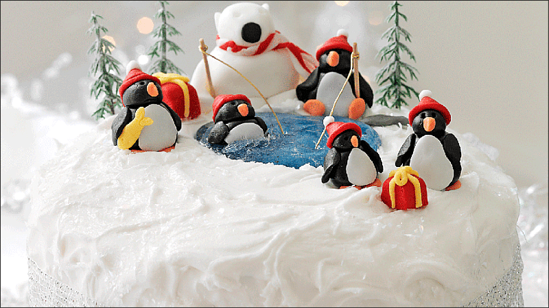 Christmas cake decoration in the shape of a penguin and polar bear