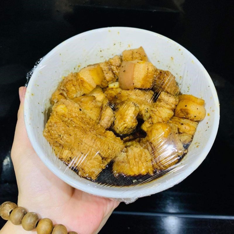 Step 3 Marinate the meat Pork belly with quail eggs in coconut water