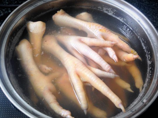 Step 2 Boiled chicken feet Chicken feet boiled with golden turmeric