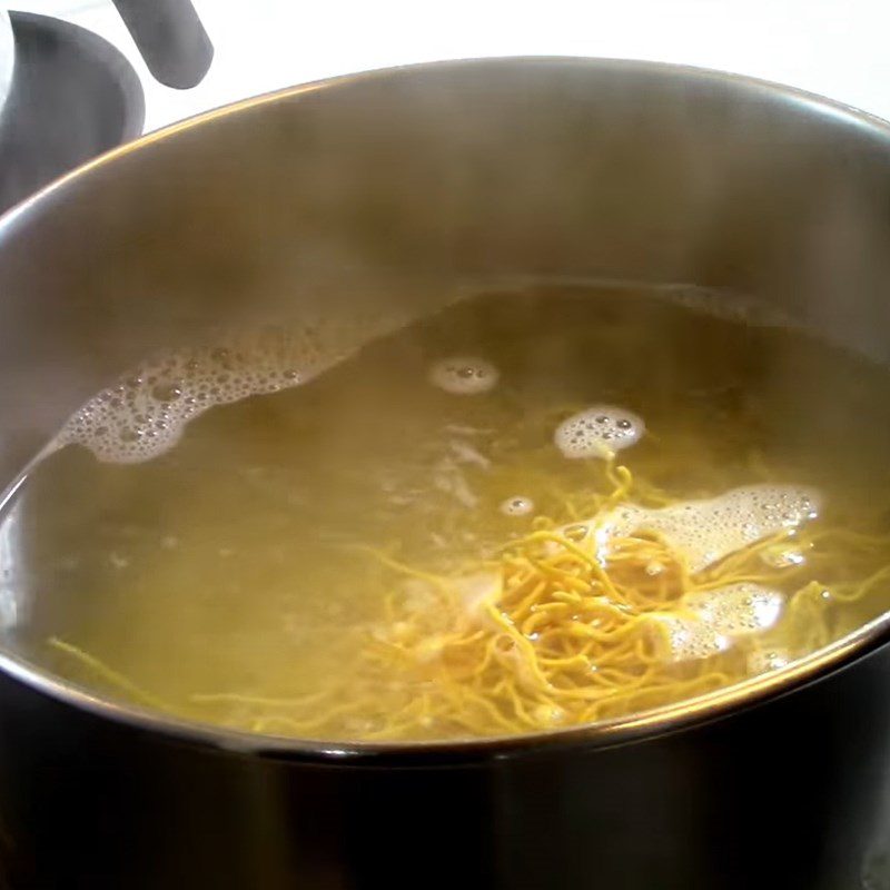 Step 2 Blanch the noodles in boiling water Noodles mixed with vegetables in soy sauce