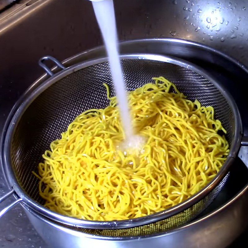 Step 2 Blanch the noodles in boiling water Noodles mixed with vegetables in soy sauce