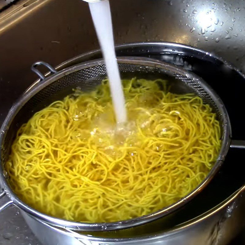 Step 2 Blanch the noodles in boiling water Noodles mixed with vegetables in soy sauce
