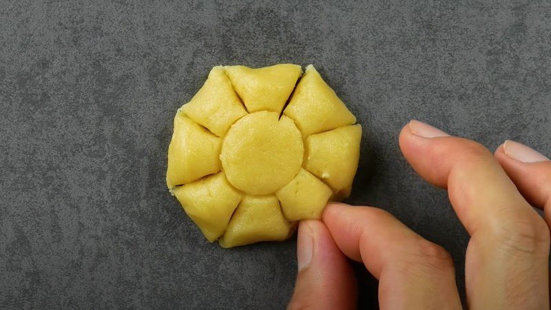 Separate the dough and pinch to form petals