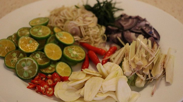 Step 3 Cut lemongrass, kumquat, garlic, and chili for Pork Ear Pickled with Lemongrass and Sweet-Sour Kumquat