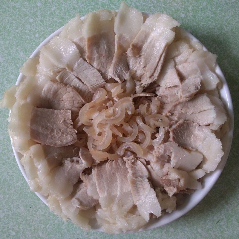 Step 2 Boil and slice the meat Boiled meat wrapped in rice paper