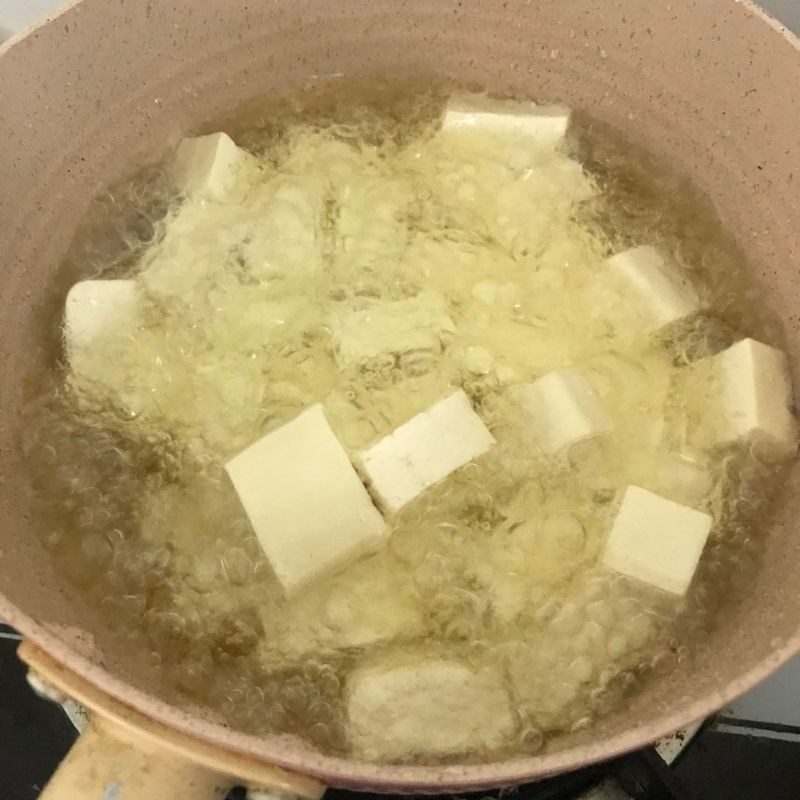 Step 2 Cooking the dish Fried tofu with fish sauce and onions