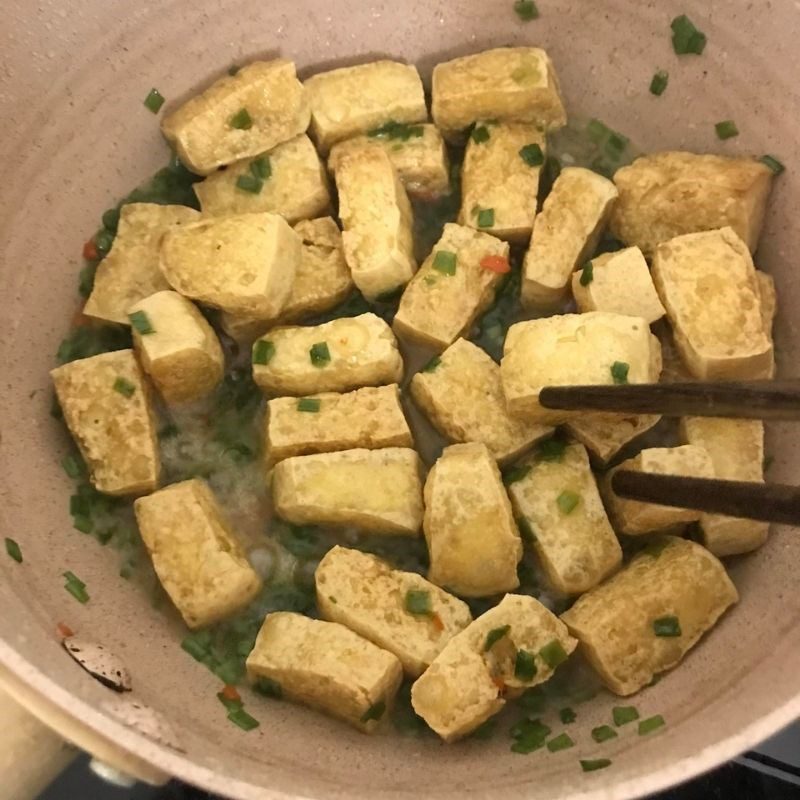 Step 2 Cooking the dish Fried tofu with fish sauce and onions