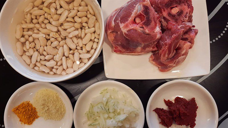 Ingredients for lamb stew with white beans and tomato sauce