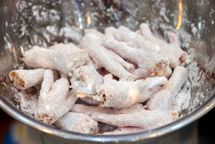 Step 2 Coat chicken feet with frying flour for Tàu Xì Chicken Feet