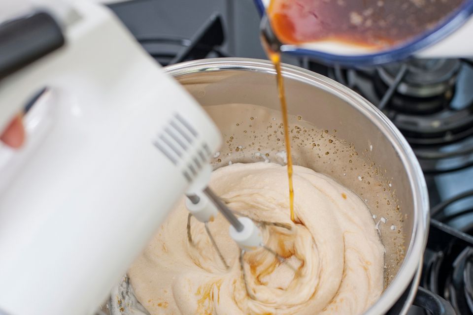 Step 3 Pour the malt syrup into the whipped egg whites Make Nougat candy from egg whites