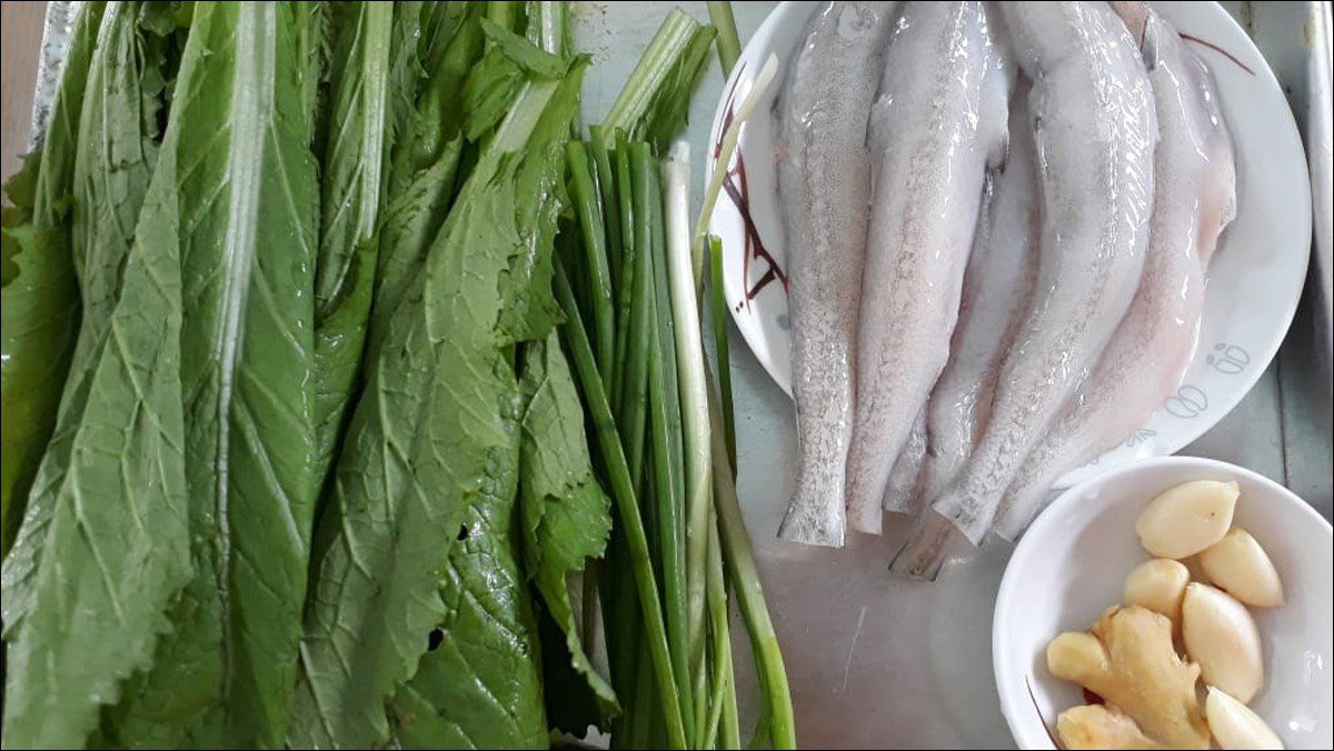 Ingredients for the dish of fish soup with sweet mustard greens