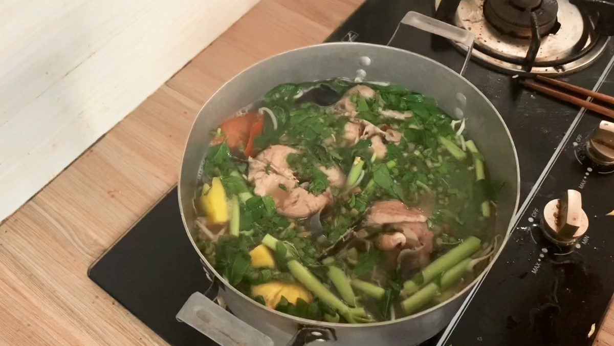 Sour catfish soup with water spinach